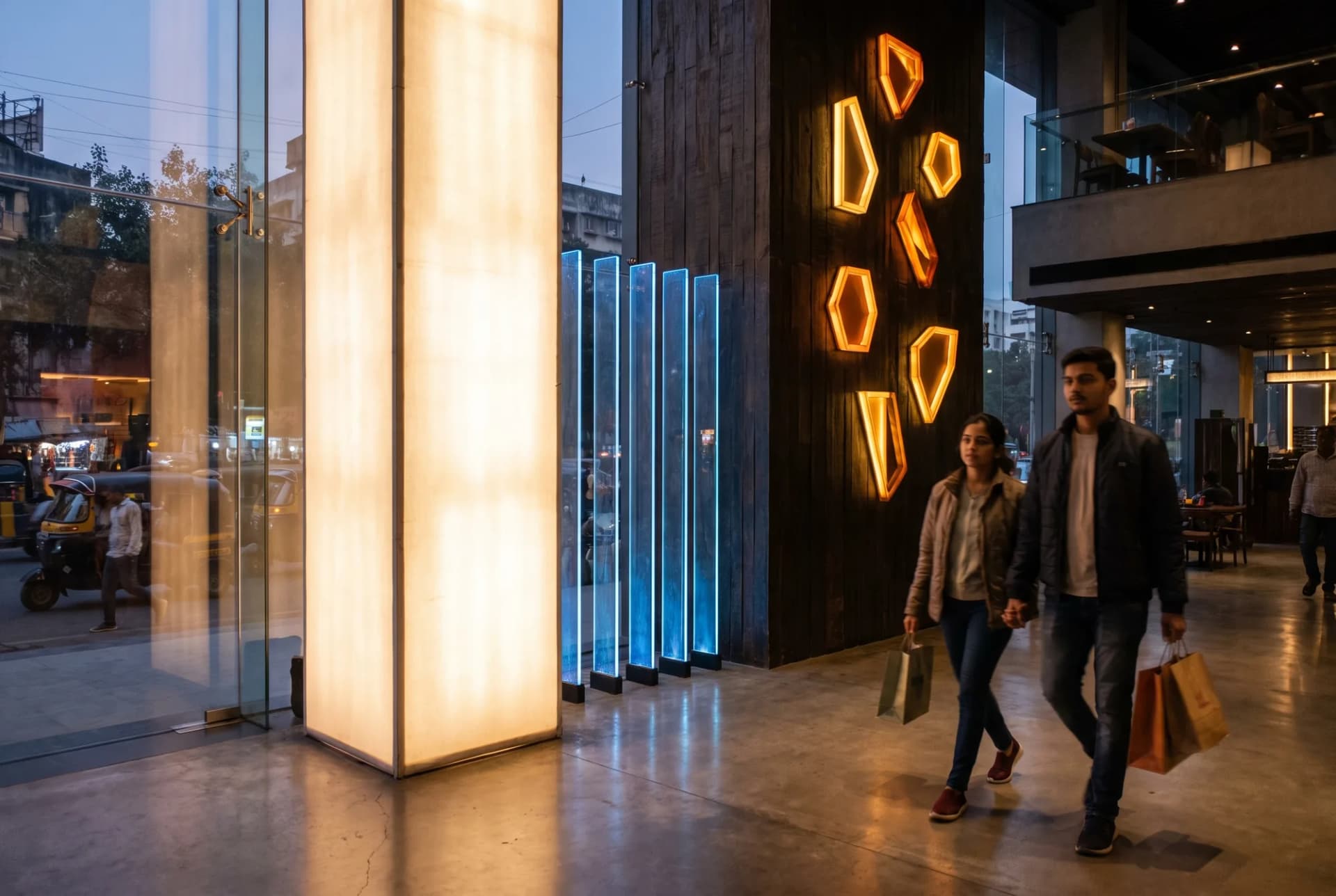 Evenly lit backlit fabric lightbox and edge-lit panels glowing in a restaurant lobby at dusk
