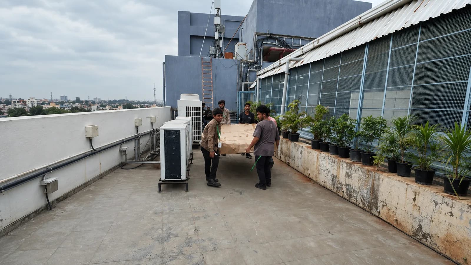 Installation team fitting signage on site